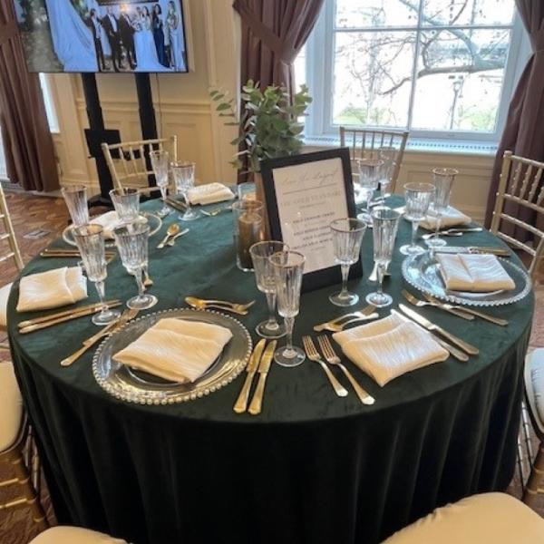 Decorated Table with TV Screen in Background