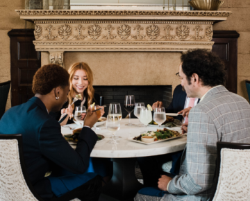 Group of people dining in university club room