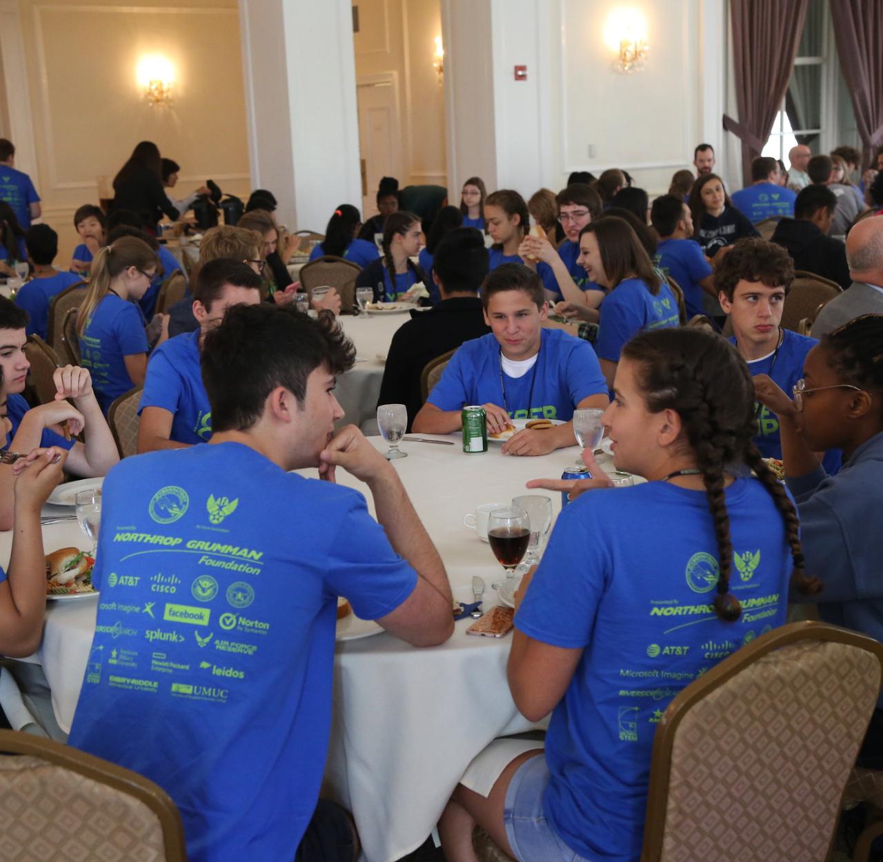 kids sitting at table during summer camp